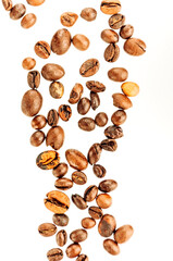 Falling coffee beans isolated on white background, clipping path, full depth of field. Cereal product. Hot drink. Close up. Harvesting. Natural background. Energy. Flying,vertical orientation