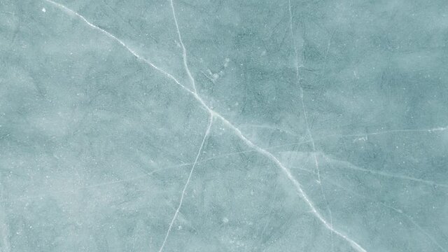 Blue cracked ice close-up, natural background, top view.