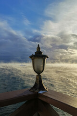 lantern on the pier by the lake