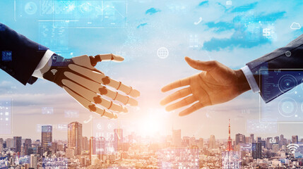 握手する人間とロボット　AI・人工知能　デジタルトランスフォーメーション 