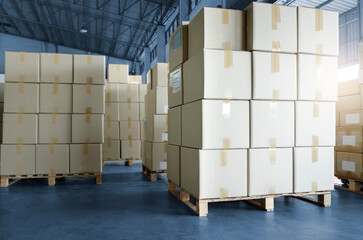 Stack of cardboard boxes on pallet rack in warehouse storage. Shipment. Cargo import and export. Manufacturing industry warehousing store.
