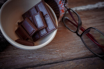 Valentine dark chocolate on old wooden background