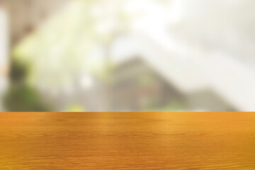 Top of empty of wood table with Blurred background of modern cafe. Using for Mock up template for craft display of your design,Banner for advertise.
