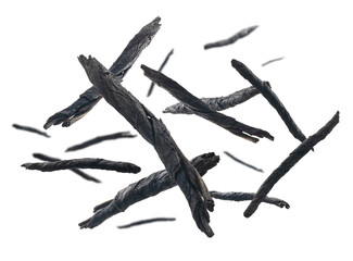 Obraz premium Dry twisted leaves of Kuding tea levitate on a white background