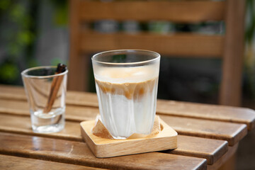 Dirty coffee, milk coffee with cinnamon stick