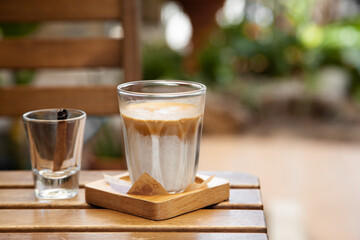 Dirty coffee, milk coffee with cinnamon stick