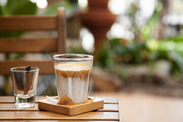 Dirty coffee, milk coffee with cinnamon stick