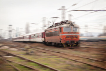 Fototapeta na wymiar Old passenger train with motion blur effect. Railway transportation
