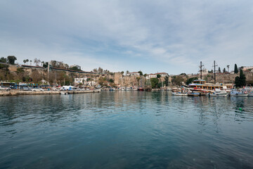 Fototapeta premium Yacht marina. The beautiful View of the city, yachts and marina in Antalya. Antalya is popular tourist destination in Turkey is a district on the Mediterranean coast. 