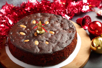 Homemade Christmas dark plum cake  on a holidays background.
