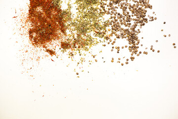 Fototapeta na wymiar Close-up dried spices, tossed on a white background.