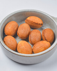 Pastry cookies nuts, cookies with condensed milk inside. Traditional Georgian dessert for tea or coffee.