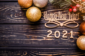 Happy new year 2021 on wooden brown background