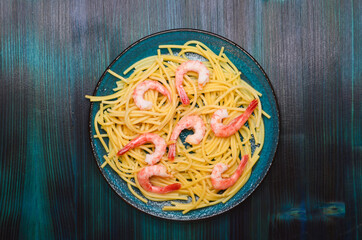 italian dish noodles with seafood, shrimp pasta, mediterranean cuisine top view