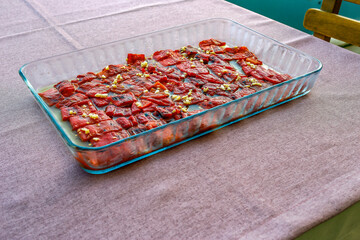 The ember paprika cold appetizer with garlic and olive oil on plate from Turkey restaurant.