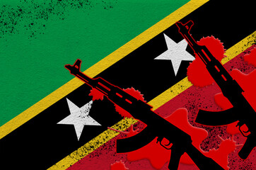 Saint Kitts and Nevis flag and two black AK-47 rifles in red blood. Concept for terror attack or...
