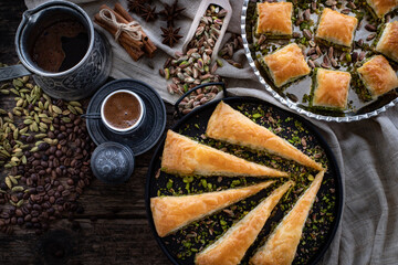 Obraz na płótnie Canvas Baklava with pistachio in the plates with coffee
