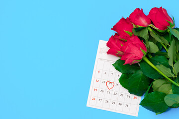 February calendar and red roses top view