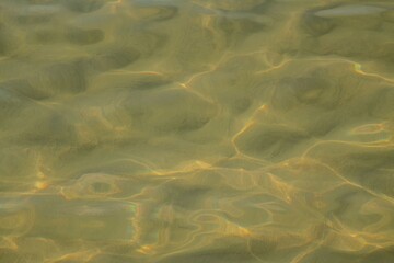sun reflection on sea water surface close up