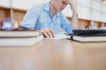 Tired businessman hold pencil at workplace in office and headache or angry. Overworking, making mistake, stress, termination, fail, bad, sad tired or depression concept