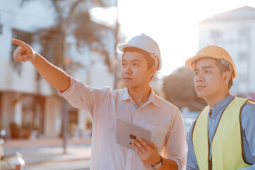 Architecture or engineerman and businessman survey and check at site construction with tablet and...
