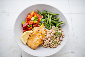 Salmon and buckwheat dish with green beans and tomato