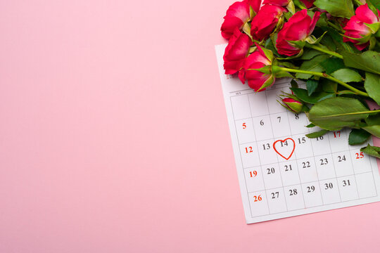 February calendar and red roses top view - Powered by Adobe