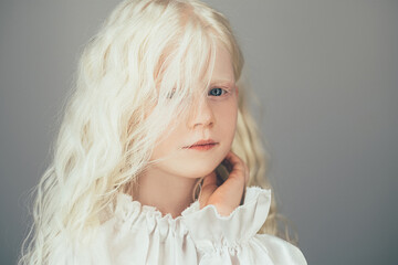 Sweet kid portrait. Natural beauty. Carefree childhood. Cute happy shy albino blonde little angel...