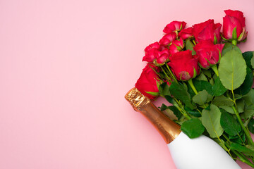 Bouquet of roses on pink background top view