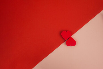 two red hearts on a red-pink background