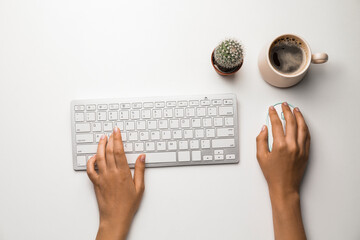 Female hands with computer keyboard on white background