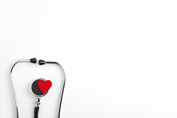 Stethoscope with Red Heart. white background. concept cardiology, medicine. with copy space top view