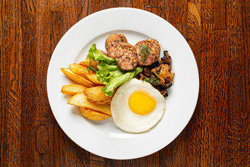 breakfast with fried egg and sausage