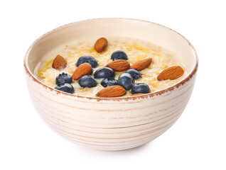 Bowl with tasty oatmeal and blueberry on white background