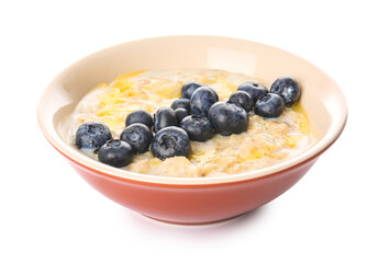 Bowl with tasty oatmeal and blueberry on white background