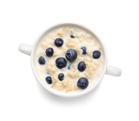 Bowl with tasty oatmeal and blueberry on white background