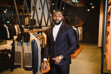 African American man in stylish new clothes on the street