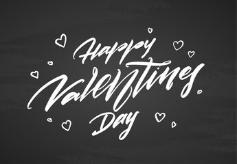Fototapeta na wymiar Hand drawn modern brush calligraphic lettering of Happy Valentines Day on blackboard background.