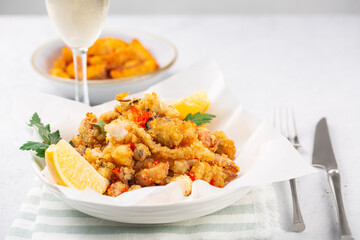 Deep fried seafood - “Fritto misto fi mare”; prawns, squid, fish fillets served with lemon.