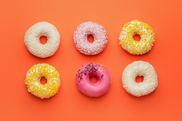 Sweet donuts on color background