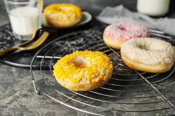 Sweet tasty donuts on table