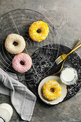 Composition with sweet donuts on table