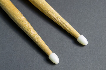 wooden drum sticks on black background