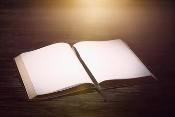 Open book on dark wooden table