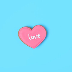 sweet cookies heart on blue background. symbol of love. Valentine's day, 14 february concept. romantic sweet gift