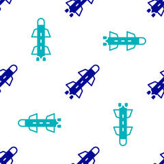 Blue Rocket icon isolated seamless pattern on white background. Vector.
