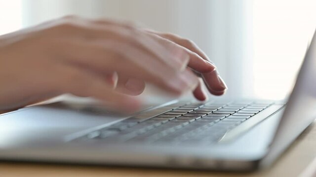 Male hands of businessman professional user worker using typing on laptop notebook keyboard sit at home office