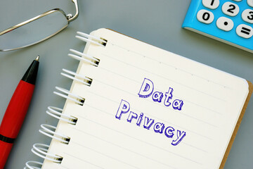 Financial concept meaning Data Privacy with phrase on the sheet.