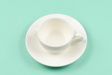 Empty cup on a green background