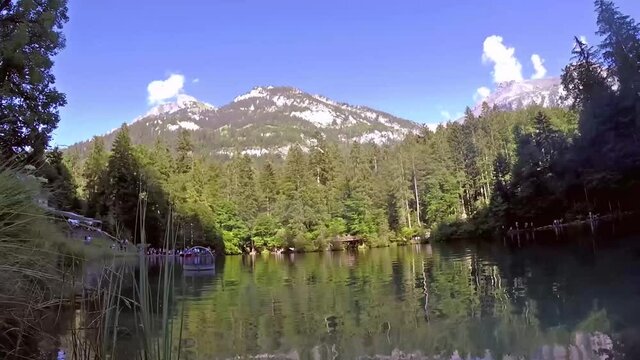 Blausee Switzerland, beautiful blue lake in natural park 